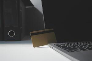 Calculator on a dark background, plastic cards and banknotes photo