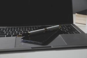 Flat lay, top view office table desk. Workspace with calculator,pen,laptop on white background.Copy Space for text,Empty Blank to word.Business Finance,Education Technology.Work from home. photo