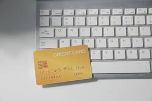 Calculator on a dark background, plastic cards and banknotes photo