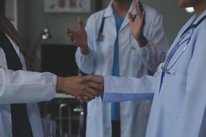 The medical team joins hands and works togetherGroup of scientists joining hands to create experimental works that meet their goals or the success of the trials that have been completed photo