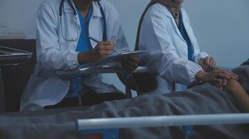 Cropped shot of a female nurse hold her senior patient's hand. Giving Support. Doctor helping old patient with Alzheimer's disease. Female carer holding hands of senior man photo