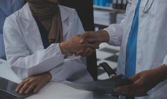 The medical team joins hands and works togetherGroup of scientists joining hands to create experimental works that meet their goals or the success of the trials that have been completed photo