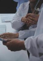 The medical team joins hands and works togetherGroup of scientists joining hands to create experimental works that meet their goals or the success of the trials that have been completed photo