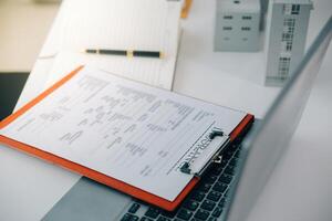 Real estate agent talked about the terms of the home purchase agreement and asked the customer to sign the documents to make the contract legally, Home sales and home insurance concept. photo