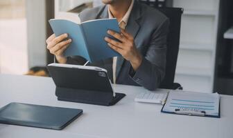 Shot of an attractive mature businesswoman working on laptop in her workstation. photo