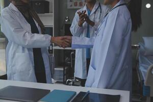 The medical team joins hands and works togetherGroup of scientists joining hands to create experimental works that meet their goals or the success of the trials that have been completed photo
