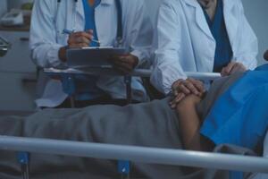 Cropped shot of a female nurse hold her senior patient's hand. Giving Support. Doctor helping old patient with Alzheimer's disease. Female carer holding hands of senior man photo