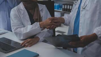 The medical team joins hands and works togetherGroup of scientists joining hands to create experimental works that meet their goals or the success of the trials that have been completed photo
