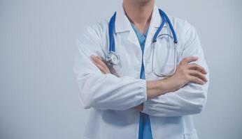 Mature male doctor with tablet pc is giving presentation. Blurred background indoors. photo