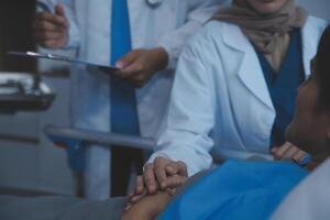 Cropped shot of a female nurse hold her senior patient's hand. Giving Support. Doctor helping old patient with Alzheimer's disease. Female carer holding hands of senior man photo