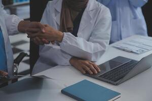 The medical team joins hands and works togetherGroup of scientists joining hands to create experimental works that meet their goals or the success of the trials that have been completed photo