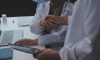 The medical team joins hands and works togetherGroup of scientists joining hands to create experimental works that meet their goals or the success of the trials that have been completed photo