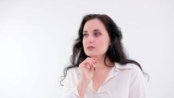 What, how could you Confused woman with brunette hair in blouse standing with raised hands, asking what's reason why, indignant annoyed expression. indoor studio shot isolated on white background video