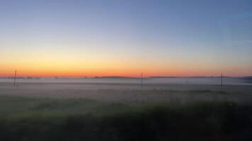 Break of dawn and early morning UK countryside. Sunrise. Trains. Mistfog video