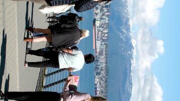 Canada Place walk along the promenade talking on the phone sunglasses snacks lunch taking photos real life in a big city in a pacific port near the mountains in spring in canada vancouver video