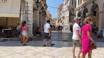 Corfu, Greece 01 Sep, 2023 The tourists are in cafes and restaurants in Liston square during summer vacation hollidays, 60 motion video