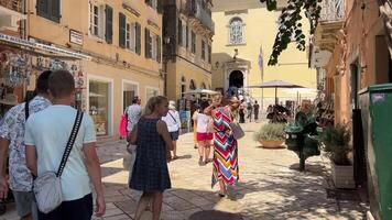 Corfu, Greece 01 Sep, 2023 The tourists are in cafes and restaurants in Liston square during summer vacation hollidays, 60 motion video