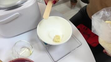 Butter being weighed for a chocolate cake video