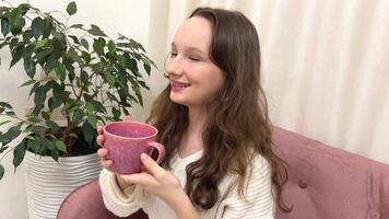 Beautiful girl drinks tea after massage procedures in spa salon video