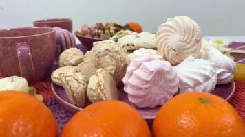 Festive New Years cake decorated with all sorts of fruits spinning on a rotating stand. video