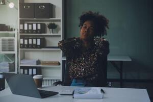 Asian women Aches from working She felt like relaxing photo