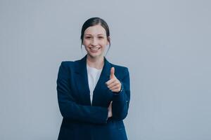 Successful young asian businesswoman in suit ready do business, cross arms confident and smiling. Female entrepreneur determined to win. Happy saleswoman talking to clients, white background photo