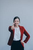 Happy young businesswoman on white background photo