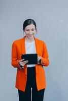 Smiling caucasian young woman girl freelancer student using digital tablet, having idea, pointing upwards on copyspace, surfing on social media, mobile applications, e-learning isolated in white photo