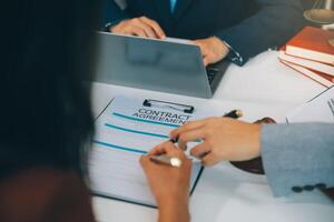 Businessman and lawyer discuss the contract document. Treaty of the law. Sign a contract business. photo