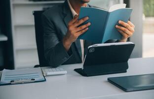 Shot of an attractive mature businesswoman working on laptop in her workstation. photo