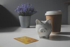 close up on calculator with group of mail letter and credit card at white table for end of the month expense day concept photo