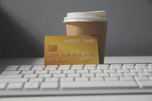 Calculator on a dark background, plastic cards and banknotes photo