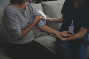 Doctor doing professional pressure examine her young patient photo