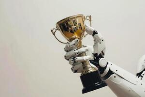 A robot hand holding a trophy. photo