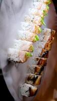 delicious restaurant asian food sushi on plate with dry ice eel tuna set enveloping all around space for text advertising sushi serving menu chef courses sushi maker close-up incredibly delicious video