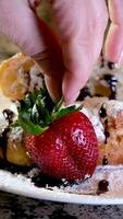 close-up of croissant sprinkled serving cook at home decorate many different videos with strawberries and chocolate sprinkled with syrup sprinkled with different toppings photos and videos