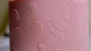 decoration of a cake for a family christening pink cake with footprints of small child on top of angel wings and baby in pink diaper a girl how to find out gender of child with the help of a cake video