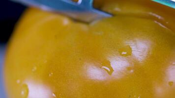 slices of yellow juicy tomato , rotation in circle. background yellow tomato, Turning. selective focus. seasonal vegetables. vertical video