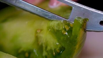 Cooking image of a young woman cutting tomatoes video