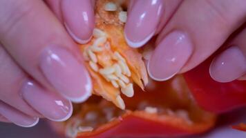 A shift focus slow motion shot of yellow capsicum bell pepper being chopped video