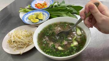 Close-up portrait of young women enjoy eating noodles in a cup at home. Junk food concept. video