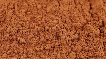 un lote de cacao polvo de cerca. cacao antecedentes o textura. video