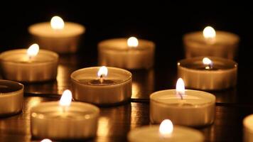 Many burning candles with shallow depth of field. video