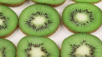 Sliced kiwi. Kiwi texture or background. a lot of kiwi slices video