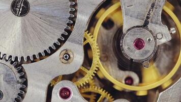 Clock mechanism close-up. Close-up of metal clock works video