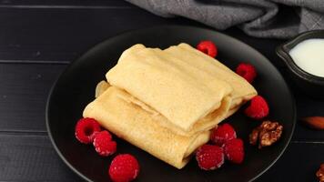 Pancakes with berries. Crepes with Fresh Berries. Plate with tasty pancakes and berries video