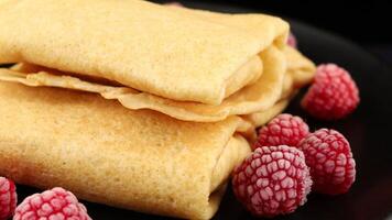 Pancakes with berries. Crepes with Fresh Berries. Plate with tasty pancakes and berries video