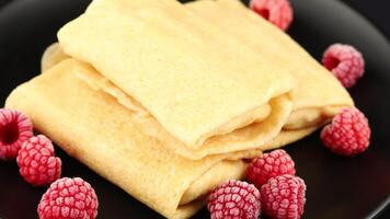 Pancakes with berries. Crepes with Fresh Berries. Plate with tasty pancakes and berries video