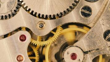 Clock mechanism close-up. Gears and cogs in clockwork watch mechanism video