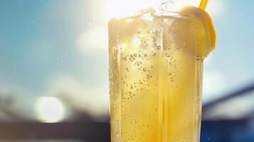 Refreshing glass of lemonade, condensation glistening in the summer heat photo